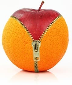 une pomme rouge en enfermée dans une orange fermée par fermeture eclair