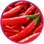 plusieurs piments rouges et verts entourés d'un cercle rose