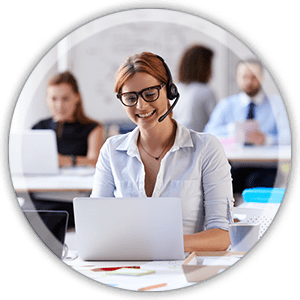 circle img 3 office woman at a desk working weaaring a headset smiling