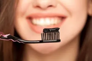 Whiten teeth with charcoal toothpaste