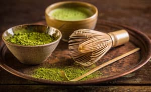 Image of Matcha Tea powder with bamboo whisk and bamboo scoop Image of Matcha Tea powder with bamboo whisk and bamboo scoop